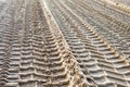 footprints of construction machine equipped with caterpillars on a building site