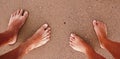 Footprints couple in love in the sand on the beach