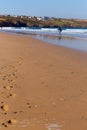 Footprints on Crantock virgin beach North Cornwall England UK near Newquay for early morning surfing Royalty Free Stock Photo