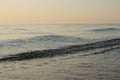 Calm bue waves on the sea sunset evening Royalty Free Stock Photo