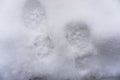 Footprints in fresh snow. Winter background. Human trace Royalty Free Stock Photo