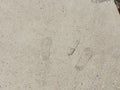 Footprints imbedded in the concrete sidewalk Royalty Free Stock Photo