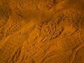 Footprints left on the red sand. Abstract Rustler canyon, Provencal Colorado near Roussillon, Southern France. Royalty Free Stock Photo