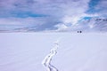 Footprints of man walking in the snow. Mountain plain winter landscape Royalty Free Stock Photo