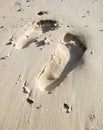 Footprints of man and woman on white sand by the beach. Couples trip.