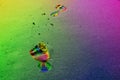 Footprints in rainbow colors on the beach Royalty Free Stock Photo