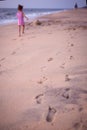 Footprints in the sand from children`s feet. Royalty Free Stock Photo