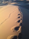 Footprints in the sand dunes Royalty Free Stock Photo