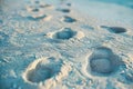 Footprints in the sand by eddie mccarthy for stocksy united Royalty Free Stock Photo