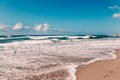 Footprints in sand on the ocean beach, blue sky, white clouds, y Royalty Free Stock Photo