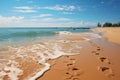 Footprints in the sand on the seashore