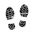 Footprints and shoeprints icon in black and white showing bare feet and the imprint of the soles with patterns of male