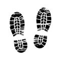 Footprints and shoeprints icons in black and white showing bare feet and the imprint of the soles with the differing Royalty Free Stock Photo