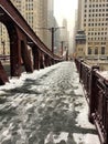 Footprints on snow covered bridge across the Lasalle Street bridge in Chicago Loop Royalty Free Stock Photo