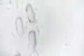 Footprints in the snow. Footprints on the first snow. Imprint of Royalty Free Stock Photo