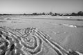 Footprints in the snow on frozen river