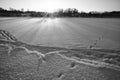 Footprints in the snow on frozen river