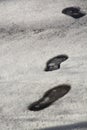 Footprints in snow. Snow texture with shoeprints.