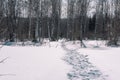 Footprints in the snow. Human footprint Imprint of shoes in the snow