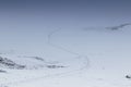 Footprints in snow leading over frozen lake Royalty Free Stock Photo