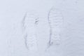 Footprints in the snow of walking boot