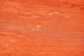 Footprints on tennis clay court