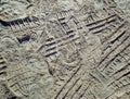 Footprints and Tire Tracks in Dry Sand Texture Royalty Free Stock Photo