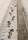 Footprints and tyre tracks Royalty Free Stock Photo