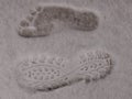 Footprints on white fluffy soft snow