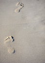 Footprints in white sand, on a beach Royalty Free Stock Photo