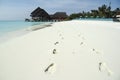 Footprints on white sand maldives beach Royalty Free Stock Photo