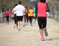 footrace with many athletes and an young african girl