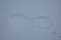 A footstep is left in snow. Royalty Free Stock Photo