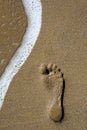 Footstep and Wave Royalty Free Stock Photo