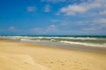 Footsteps on the beach on a sunny day