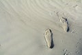 Footsteps on the beach by the sea in summer. Horizontal view of Royalty Free Stock Photo