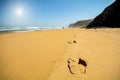 Footsteps in the sand at beach Praia do Vale dos Homens near Aljezur, Algarve Royalty Free Stock Photo