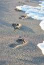 Footsteps in the sands suggesting new life paths Royalty Free Stock Photo