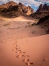 Footsteps walking alone in Wadi Rum desert, Jordan