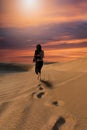 Footsteps of a woman in the desert