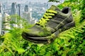 Footwear that actively reduces its carbon emissions, featuring green components and supporting a city-wide recycling system to