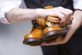 Footwear Concepts. Closeup of Mans Hands Cleaning shoes Royalty Free Stock Photo