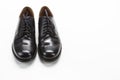 Footwear Concepts. Closeup of Pair of Male Stylish Black Polished Derby Calf Leather Laced Shoes Placed Together