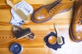 Footwear Ideas and Concepts. Close-up of Premium Tan Brogue Leather Boot with Set of Cleaning Accessories,Wax and Cloth.