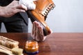 Footwear Ideas and Concepts. Extreme Close Up of Mans Hands Cleaning Luxury Calf Leather Brogues with Special Cloth Royalty Free Stock Photo