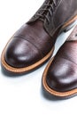 Footwear Ideas. Extreme Closeup of Toes of Premium Dark Brown Grain Brogue Derby Boots Made of Calf Leather with Rubber Sole Royalty Free Stock Photo