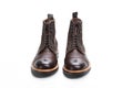 Footwear Ideas. Premium Dark Brown Grain Brogue Derby Boots Made of Calf Leather with Rubber Sole Isolated Over White Background Royalty Free Stock Photo