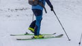 Footwork detail of a person performing a 180 degree turn while ski touring or mountaineering. Person making a turn on skis walking Royalty Free Stock Photo