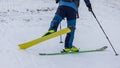 Footwork detail of a person performing a 180 degree turn while ski touring or mountaineering. Person making a turn on skis walking Royalty Free Stock Photo