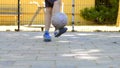 Footwork of a young boy with a ball on a street soccer pitch